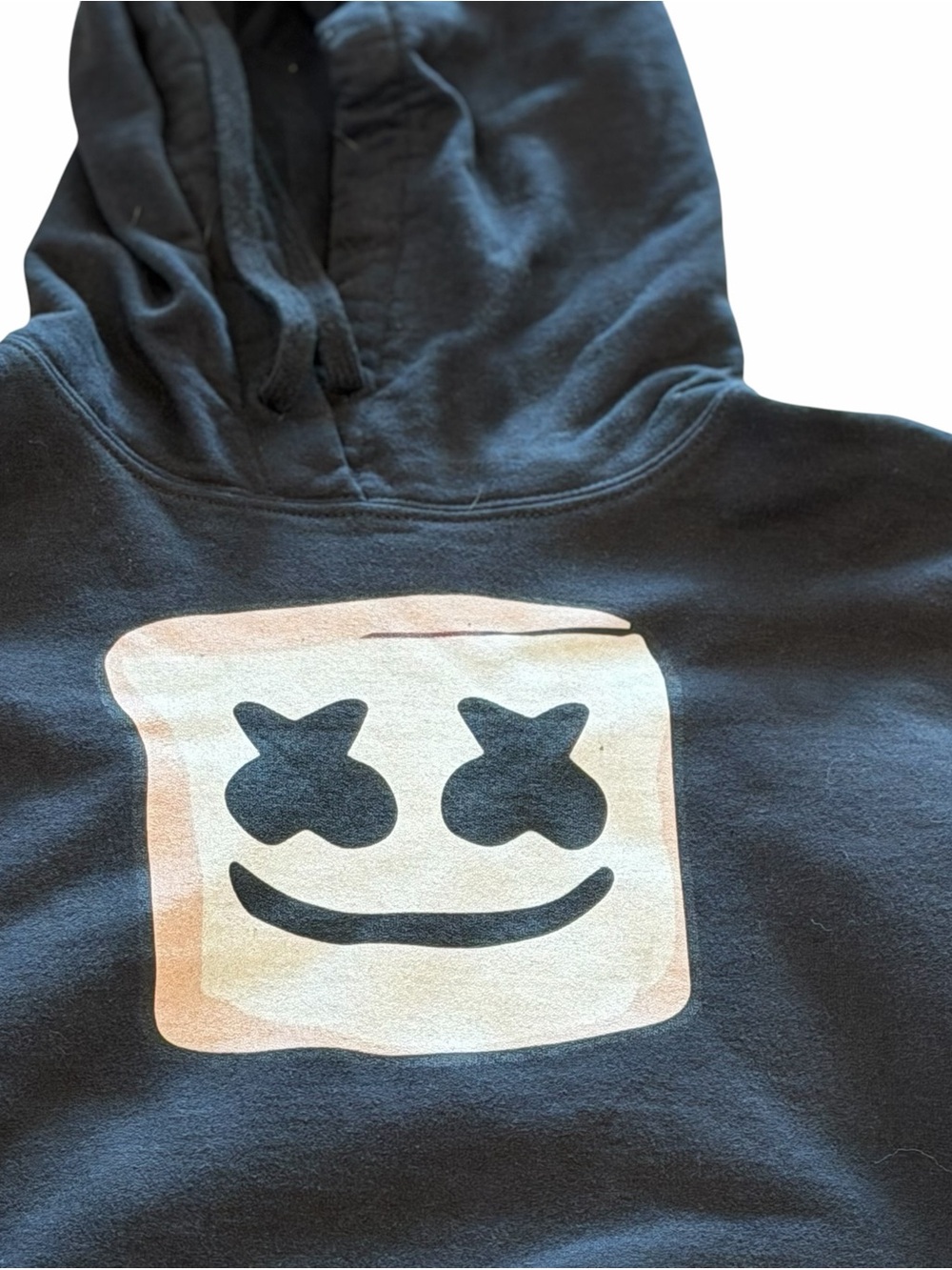 DJ Marshmello hoodie with smiley face logo on the chest